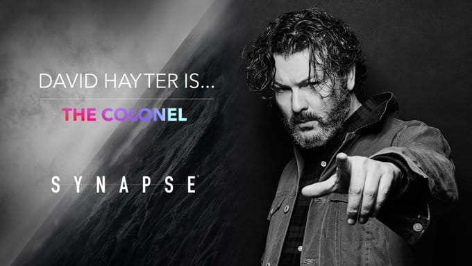 A promotional image advertising David Hayter as The Colonel in a video game called Synapse.